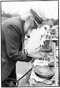 Robin Skelton examines LPs at a garage sale